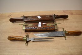 A 20th century carving set in a brass and hardwood case, decorated with Cyprus engraved to the