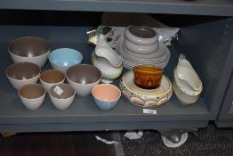 A group of 8 Poole pottery bowls, sold together with a Crown Ducal gravy jug, a Honiton devon bowl