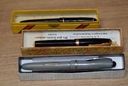 Three fountain pens. A boxed Waterman 100 Year pen, this lever fill pen is as found as the tassie
