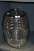 A large clear glass brandy barrel in oval form having a textured ribbed body, h33cm