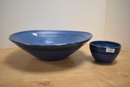 A large John O'Groats pottery bowl decorated in a blue glaze, w40cm, sold together with a similar