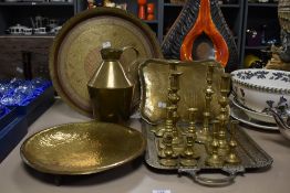 A group of brass candlesticks, largest H21.5cm, sold together with a brass pitcher and various
