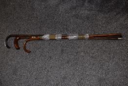 Two vintage walking canes and a walking stick with applied souvenir plaques