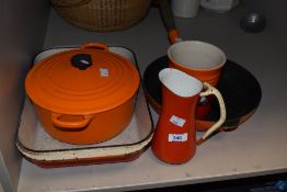 A selection of vintage Le Creuset cast iron items comprising casserole dish, skillet pan, roasting