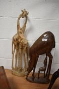 A large hard wood sculpture of an antelope mother and calf, h49cm, sold together with a carved