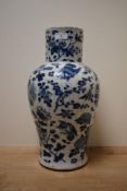 An early 20th century Chinese blue and white vase of baluster form, decorated having pomegranates,