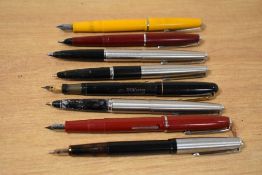A tray containing eight fountain pens including Parker 45 Flighter, Swan 3263 snd Platignum all