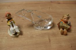 Two vintage Goebel figures depicting boy playing the accordion and girl with geese, stamped to base