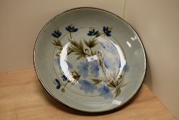 A large decorative Scottish Highland stoneware bowl, of dished circular form with floral
