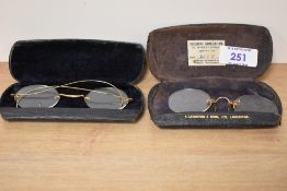 Two pairs of spectacles both in braded cases from S.Leighton & Sons Ltd Lancaster and the other