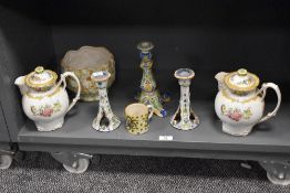 A pair of Paragon tea pots having stylised handles and floral patterns, h17cm, sold together with