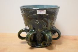 An early 20th century C.H.Brannam Barnstable style drinking vessel, having a flared body supported