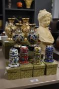 A pair of Cloisonné enamel vases of baluster form supported on laquered bases, decorated with