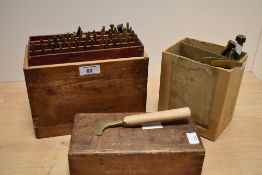 A good selection of wooden handled brass leather working tools, various including rose design,