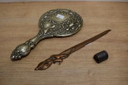 An Art Nouveau style vanity mirror, L28cm, sold together with a Art Nouveau letter opener, L27cm and