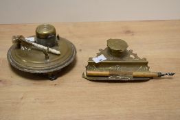 Two brass ink stands, one of moulded circular form with removable brass travelling ink well, the