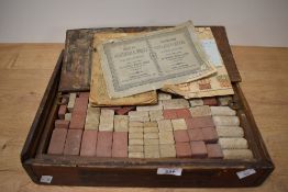 A early 20th century Richards 'Anchor' Box containing children building stones in 3 colours, approx.