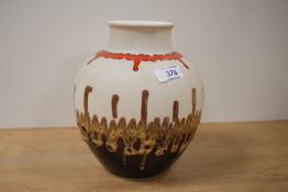 A vintage West German ceramic vase of lobbed form having brown and red patterns on a beige ground,
