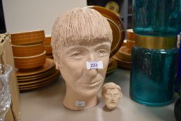 Two vintage studio pottery heads, largest measuring 26cm tall.