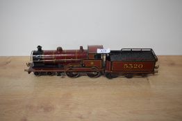 A Bassett-Lowke 0 gauge tin plate and clockwork 4-4-0 LMSR George V Loco & Tender 5320 in burgundy