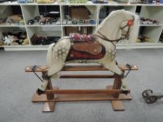 A reproduction wooden Rocking Horse having real horse hair mane and tail, leather saddle, no