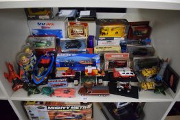 Mixed scale Die-casts, Corgi, Matchbox, Lledo and similar, boxed and loose, 30+ on one shelf
