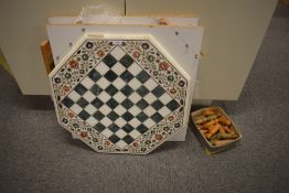 A 1970's Indian Octagonal Marble Chess Board to fit onto a table having typical floral decoration,