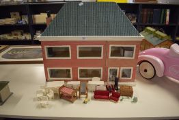 A modern wooden two storey Dolls House, height 55cm, length 66cm, depth 25cm, modern wooden