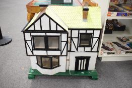 A traditional Two Storey Dolls House having bay window to front room, width 75cm, height 83cm, depth