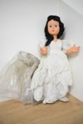 A 1950's Milano Doll having sleep eyes, closed mouth, jointed body, fully clothed with original size