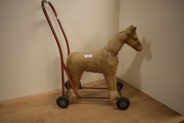 A Triang Push A Long Plush Horse on metal frame