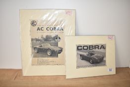 Two AC Cobra advertising posters