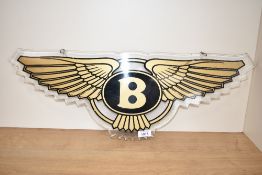A perspex Bentley advertising sign