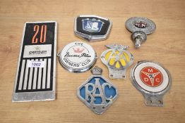 A selection of car badges including AA, RAC, Triumph, Vanden Plas, Chrysler, Motorist Discount