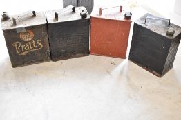 Four Pratts fuel cans with various brass caps
