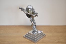 A Rolls Royce Spirit of Ecstasy on a stepped chrome base