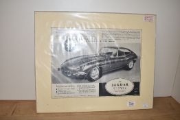 A Jaguar E Type Grand Touring Model advertising poster