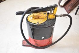 A vintage gear oil dispenser