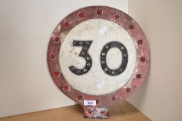 A vintage reflective 30MPH sign