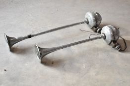 A pair of vintage car horns