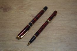 A Waterman Laureat cartridge converter fill fountain pen and propelling pencil in Red and Black