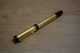 A Parker Duofold rollerball pen in gold