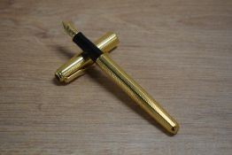 A Parker Sonnet converter fill fountain pen in Cascade Gold having Parker 18k 750 nib