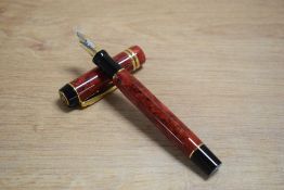 A Parker Duofold Centennial converter fill fountain pen in Red Jasper having Parker 18k 750 nib