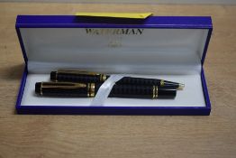 A boxed Waterman Le Man Opera Harlequin converter fill fountain pen and ballpoint pen set in black