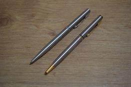 Two Parker Insignia ballpoint pens in Flighter one with gold trim