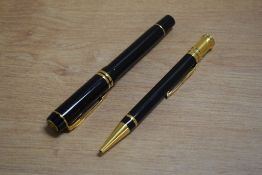 A Parker Duofold Centennial converter fountain pen and ballpoint pencil in black having Parker 18k