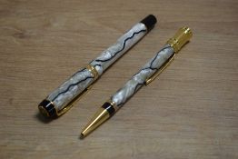 A Parker Duofold International converter fill fountain pen and ballpoint pen in Pearl and Black