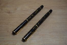 A Parker Rialto converter fill fountain pen and rollerball pen in Laque Dusk