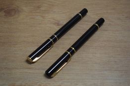 A Waterman Laureat cartridge converter fill fountain pen and rollerball pen in Black the fountain